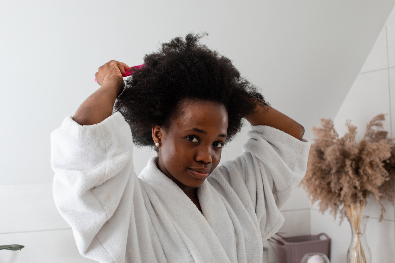 Charming Smiling Afro-American Girl with Messy Hair